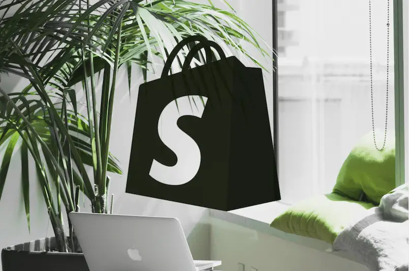 Shopify logo on an office scene
